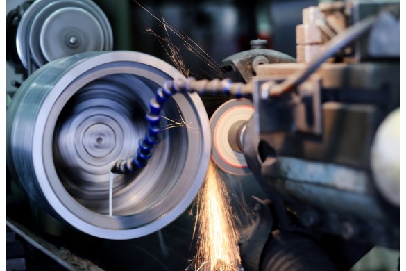 Methods of hole grinding in metal